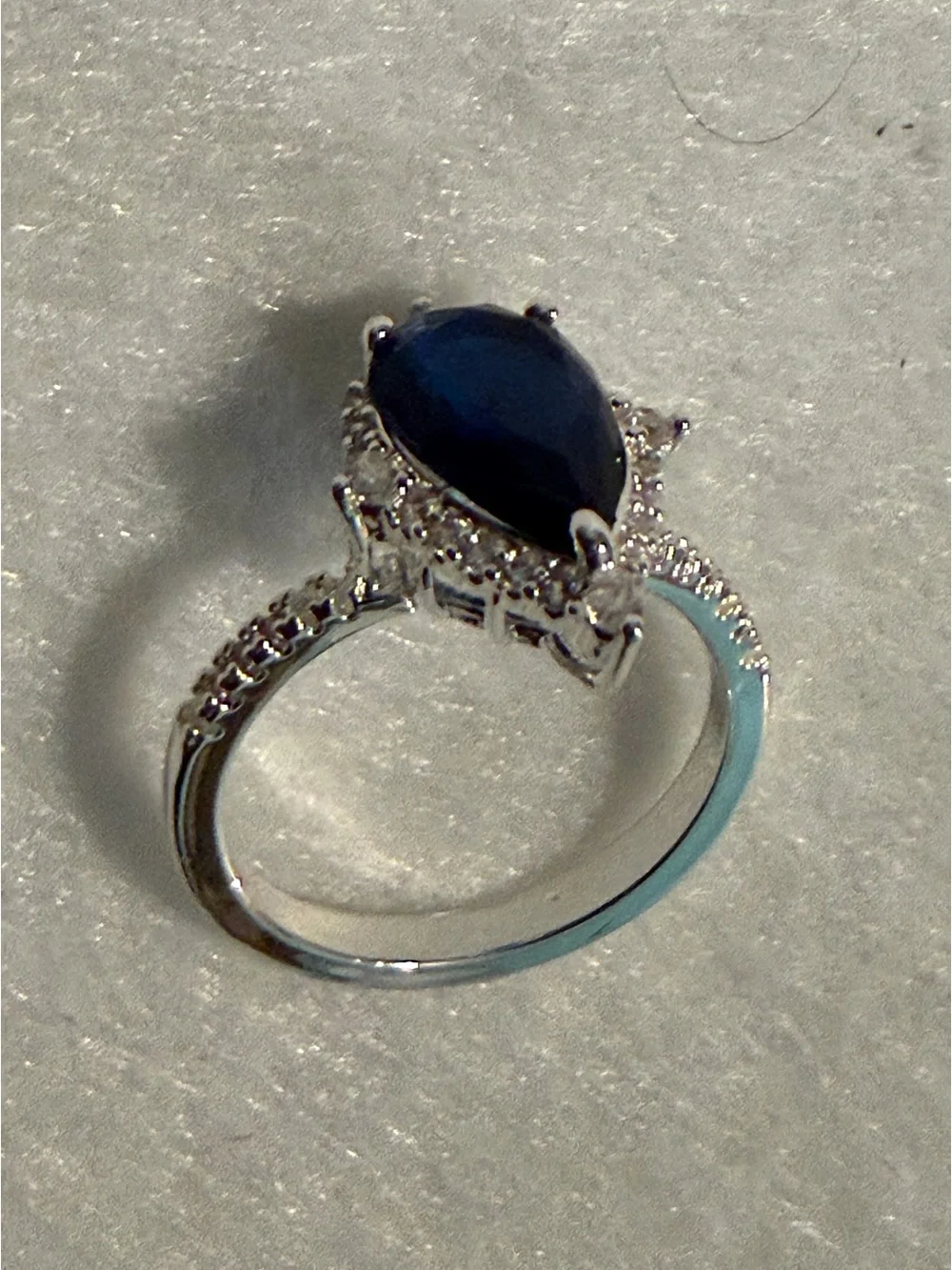 Silver Ring with Deep Blue Teardrop Stone and Pavé Accents